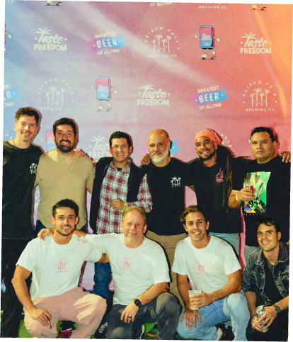 Prison Pals team together in front of the brand backdrop